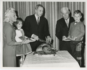 Mrs. H. Lawrence Bogert, Jr., Mr. Burrows and Hermann G. Place with two young clients at Thanksgiving celebration