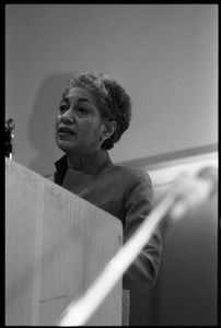 June Jordan, speaking at the podium