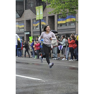 Woman runs toward finish line at the One Run