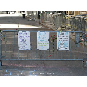 Signs on Newbury St. barricade