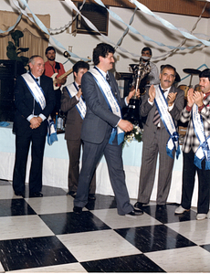 Helio M. Melo walking with trophy