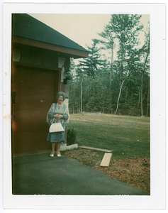 Deolinda Mello, posing outside garage