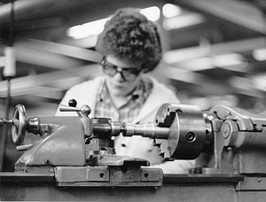 Unidentified woman at sewing machine