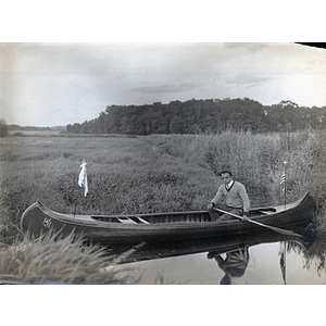 Charles H. Bruce sitting in canoe