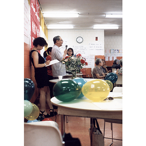 Man addresses a crowd gathered for a celebration of the Chinese Resident Association