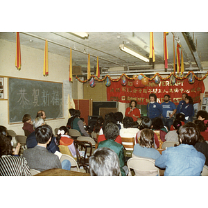 Suzanne Lee and others speaking at a Chinese Progressive Association event