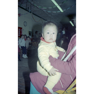 Baby at a Chinese Progressive Association anniversary event