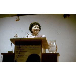 Woman speaks at the Chinese American Joint Action Committee meeting