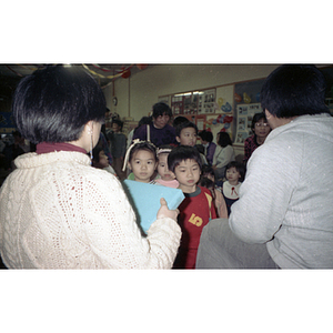 Children await the distribution of gifts at the Chinese Progressive Association's celebration of the Lunar New Year