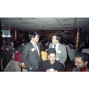 Two men at a Chinese Progressive Association gathering to celebrate the Lunar New Year