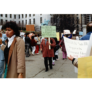 Demonstrators hold a rally at the Massachusetts State House in support of bilingual education in schools