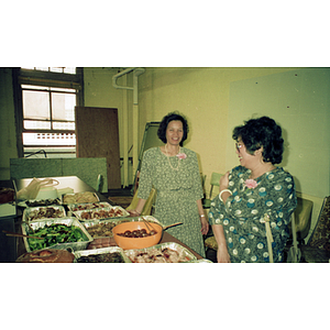 Two women at Andy's Garment Workers Food Service Graduation