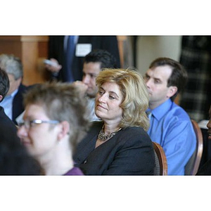 A woman smiles in the audience at the Training Future Innovators Entrepreneurs Panel