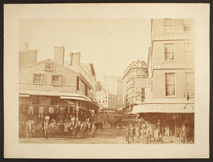 View of commercial buildings and traffic, "Old" Adams Square