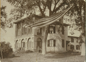 Exterior view of Castle Tucker with American flag in foreground, Wiscasset, Maine, undated