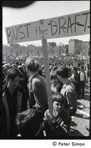 Resistance on the Boston Common: young boy holding a sign reading 'Bust the draft'