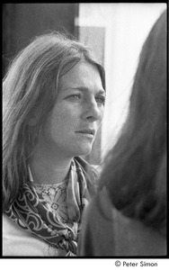 Judy Collins talking with Joan Baez at the Newport Folk Festival