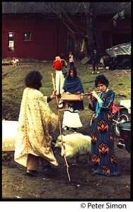 Elliot Blinder, Casey the goat, with Jenny Buell playing the flute in the farmyard, Tree Frog Farm commune