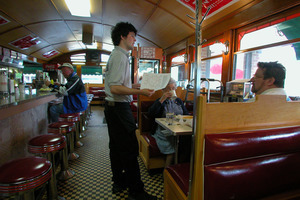 Waiter taking an order at a booth at the Miss Florence Diner