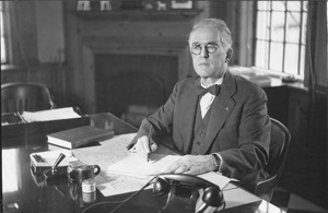 Hugh P. Baker working at his office desk