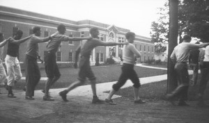 Students gathering along a road during mountain day