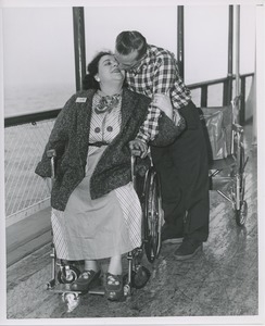 Disabled couple kissing on boat ride