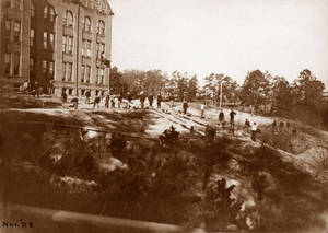 Working on the grounds outside the dorm in November 1898