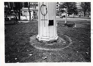 Detail of structure in Boston Common with a graffitied female sign