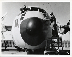 Two unidentified men with a U.S. Air Force aircraft