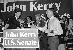 Mayor Raymond L. Flynn shaking hands with John Kerry at the podium during a Kerry campaign event at the Sheraton Boston