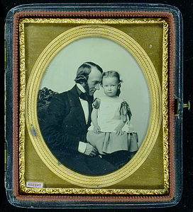 Rufus Wyman holding his daughter Susy, 1854