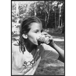 Youth drinking out of cup at Pleasant Valley camp