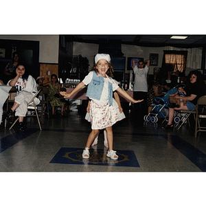 A young girl dances at an event during the Festival Puertorriqueño