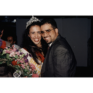 Yaritza Gonzalez, Miss Festival Puertorriqueño 1996, smiles and poses with a man