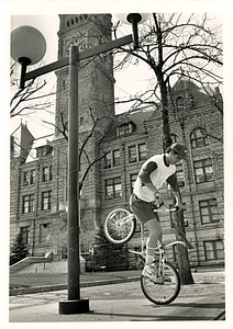 Elvis Costa does bike tricks in JFK Plaza.
