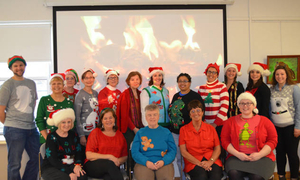 Library staff meeting--ugly Christmas sweater contest