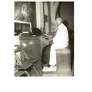 Laymon Hunter sits at the organ