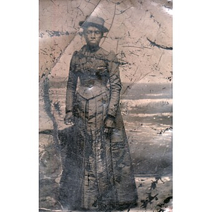 An African American woman in a pleated skirt