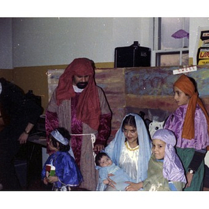 Joseph, Mary, and the baby Jesus are greeted by three wise men during a Three Kings' Day celebration at La Alianza Hispana.