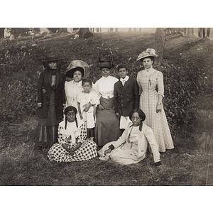 Group portrait, women and children outside