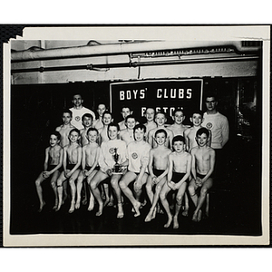 Boys' Club Bunker Hill swim team posing with their trophy