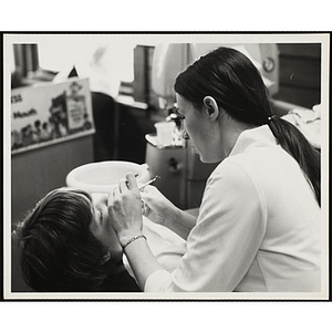 A boy receives a dental exam