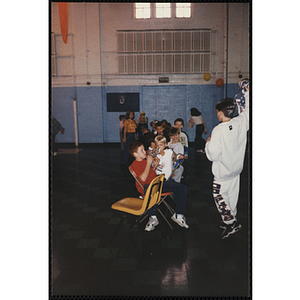 A Group of children sitting and hanging out during an open house