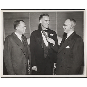 Former Massachusetts Governor Christian A. Herter receives an award from Frederic C. Church, at left, and William H. Montgomery at the Northeast New England Area Council Recognition Dinner