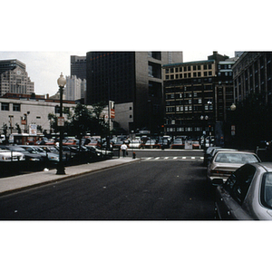 Street view of an intersection, a parking lot, and buildings in downtown Boston