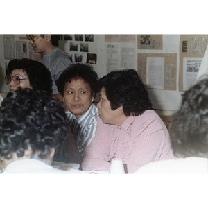 Guests talking at an International Women's Day event