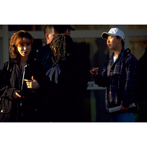 Group of students conversing near the campus police station