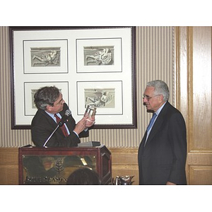 President Richard Freeland presenting John Hatsopoulos, right, with an award