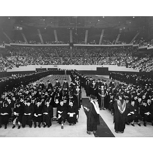 Students file into their seats at 1955 commencement ceremony in Boston Garden