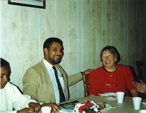 Wil Colom and Marjorie Merrill, seated at the dinner table